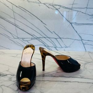 Christian Louboutin black patent slides. Worn only a few times, Size 38.